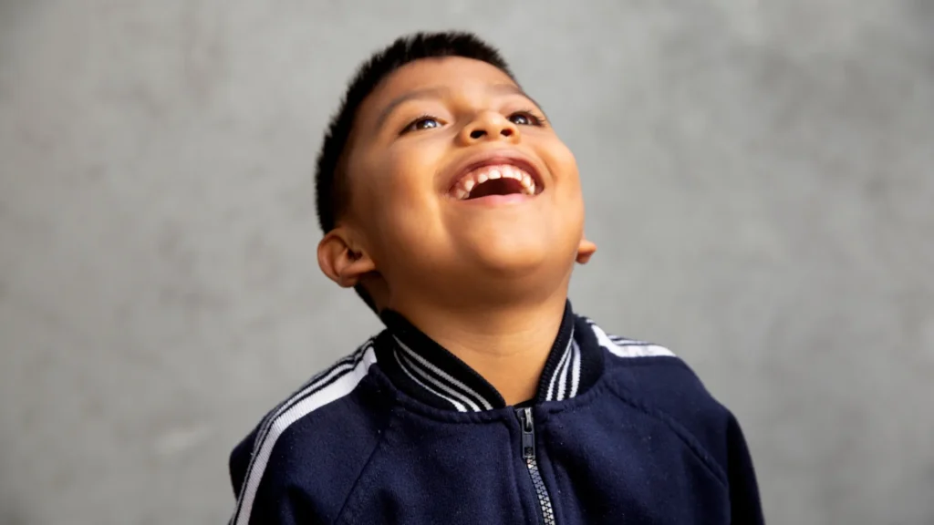 Boy Enjoying the Thursday Jokes from his Teachers