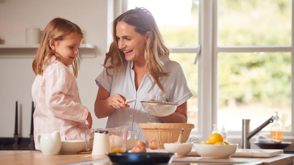 Mom Cooking and Sharing exciting Thursday Jokes with her Daughter