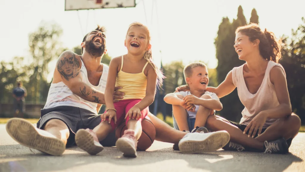 Parents Sharing Thursday Jokes with their Kids and Laughing